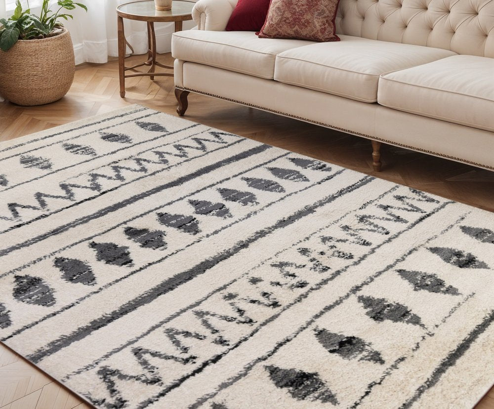 5' X 8' Cream Black And Gray Geometric Shag Area Rug