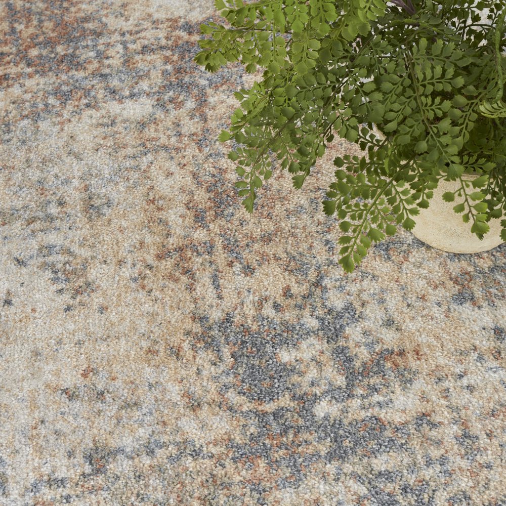 4' X 6' Blue and Ivory Abstract Power Loom Washable Area Rug