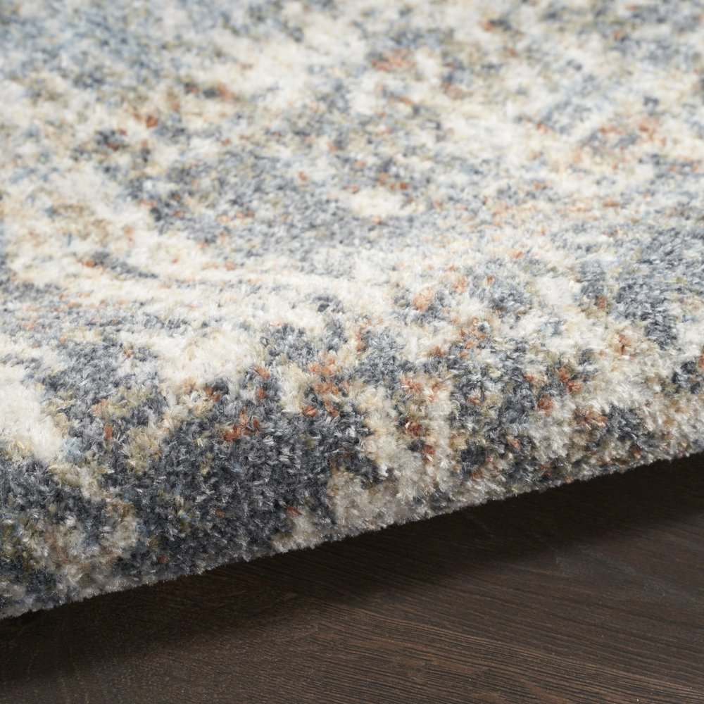 5' X 7' Blue And Ivory Abstract Washable Area Rug