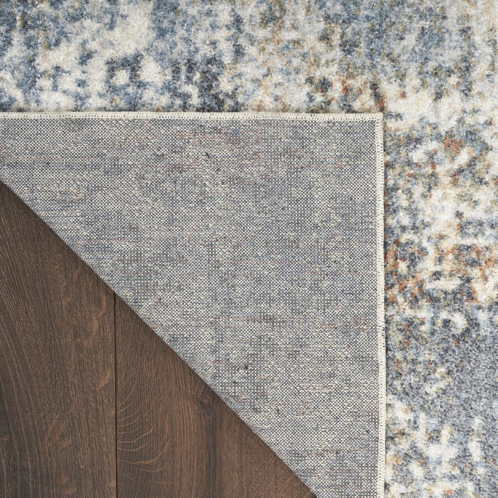 7' X 9' Blue and Ivory Abstract Power Loom Washable Area Rug