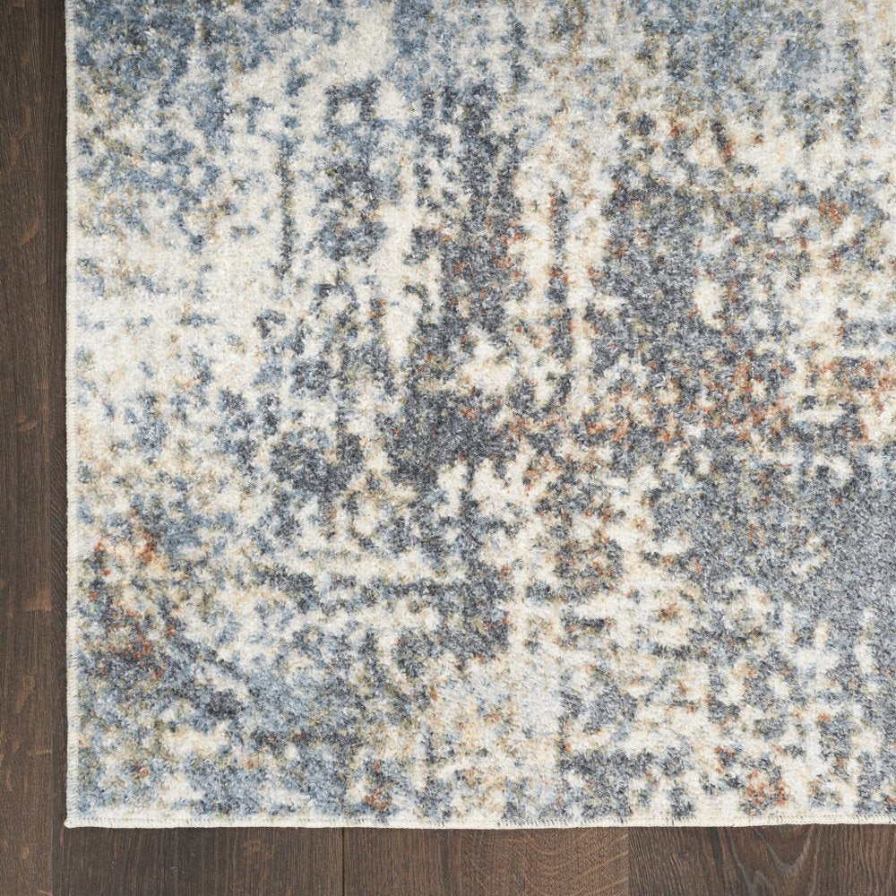 7' X 9' Blue and Ivory Abstract Power Loom Washable Area Rug