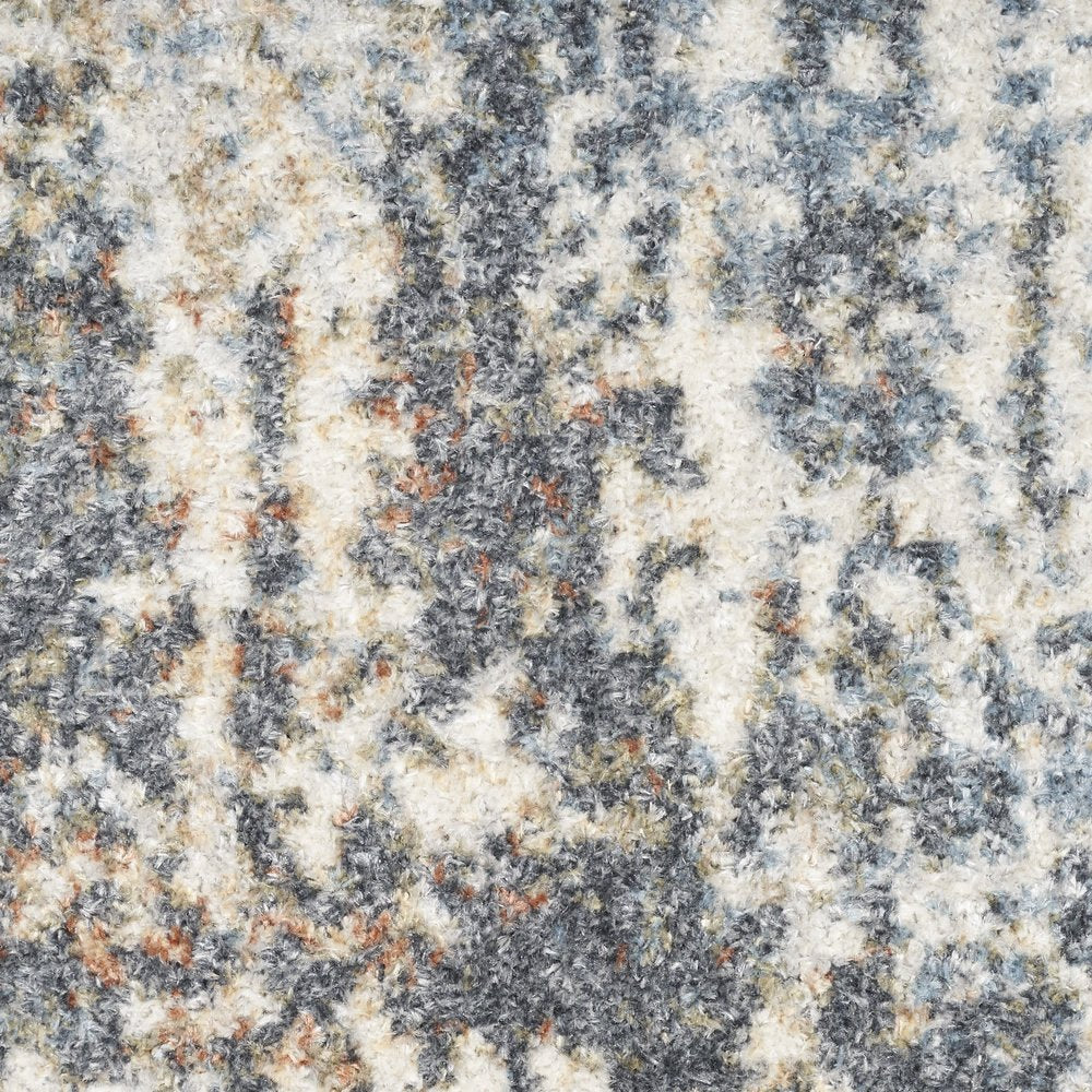 7' X 9' Blue and Ivory Abstract Power Loom Washable Area Rug