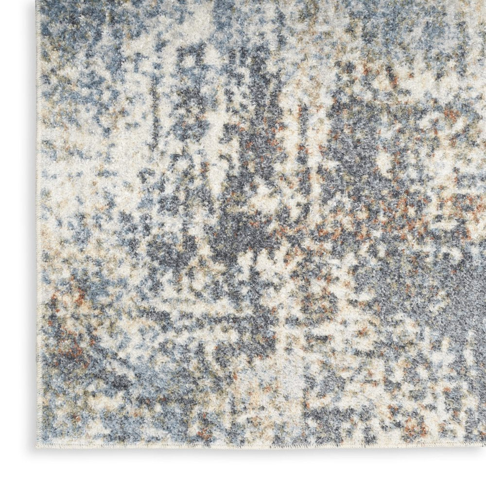 7' X 9' Blue and Ivory Abstract Power Loom Washable Area Rug