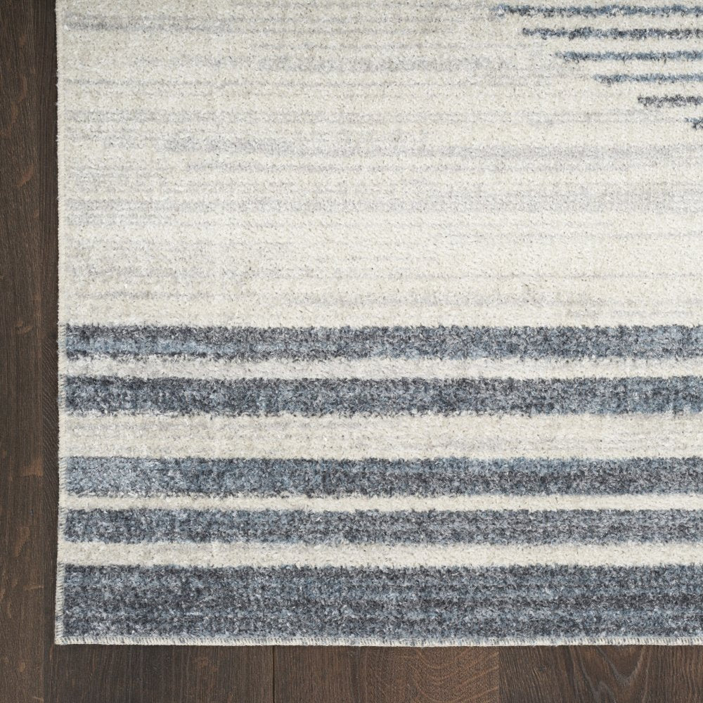 3' X 5' Blue and Ivory Geometric Power Loom Washable Area Rug