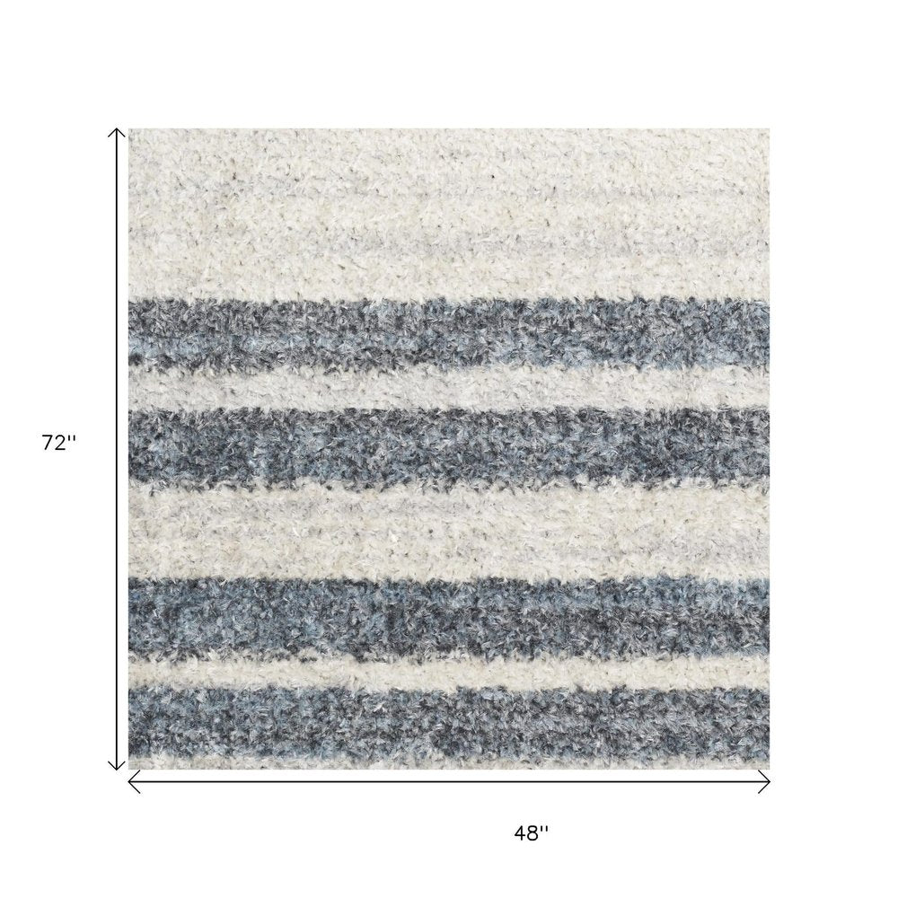 4' X 6' Blue and Ivory Geometric Power Loom Washable Area Rug