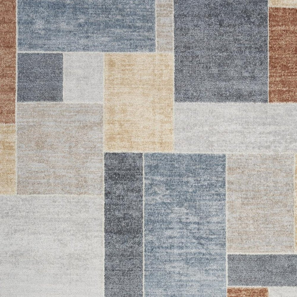 7' X 9' Blue and Green Geometric Power Loom Washable Area Rug