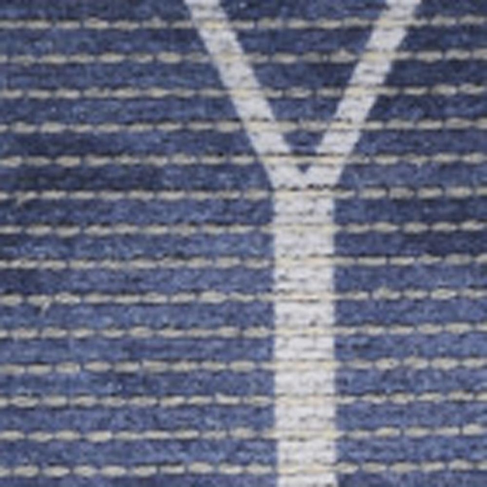 5' X 7' Blue and Ivory Geometric Power Loom Washable Area Rug