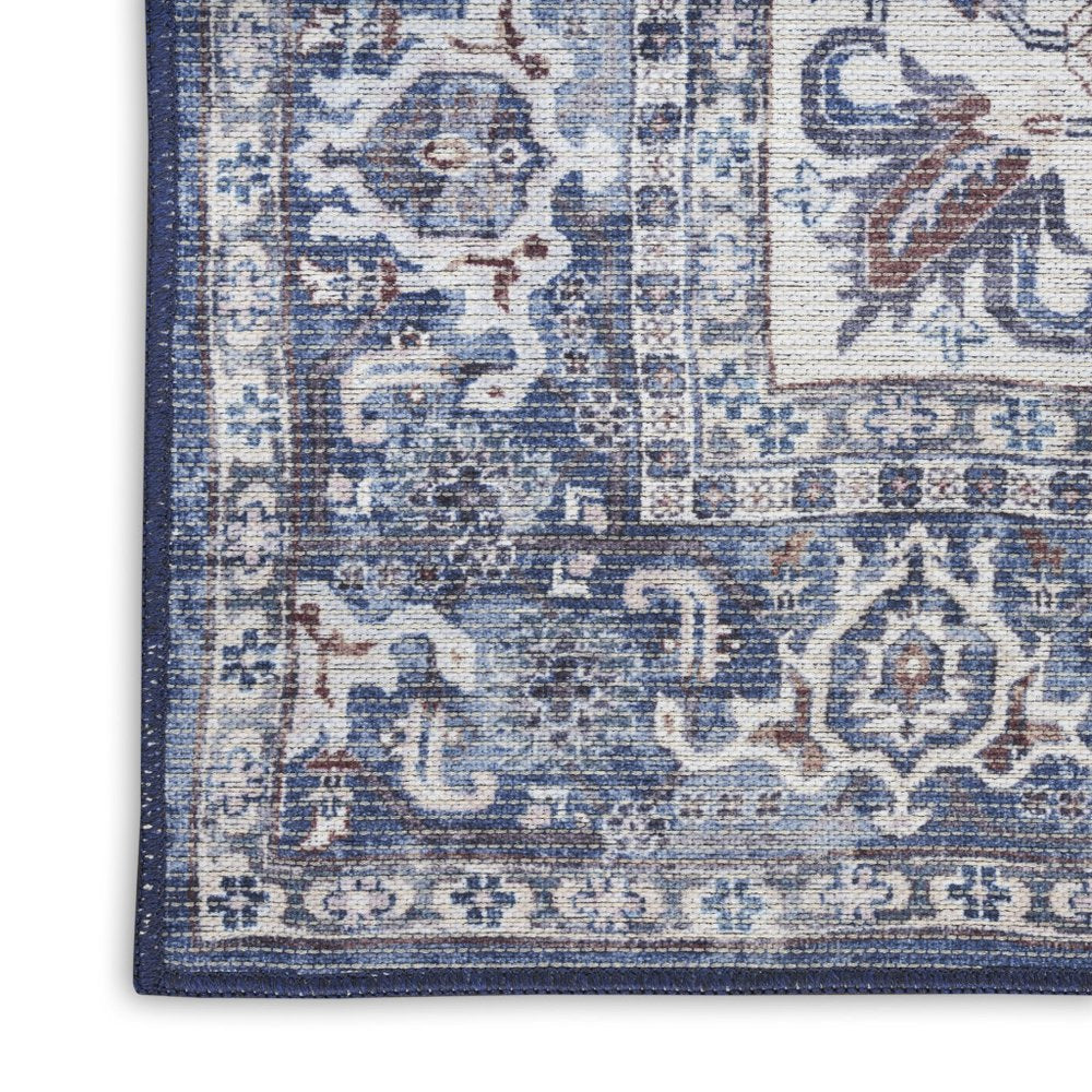 10' Blue and Ivory Floral Power Loom Distressed Washable Runner Rug