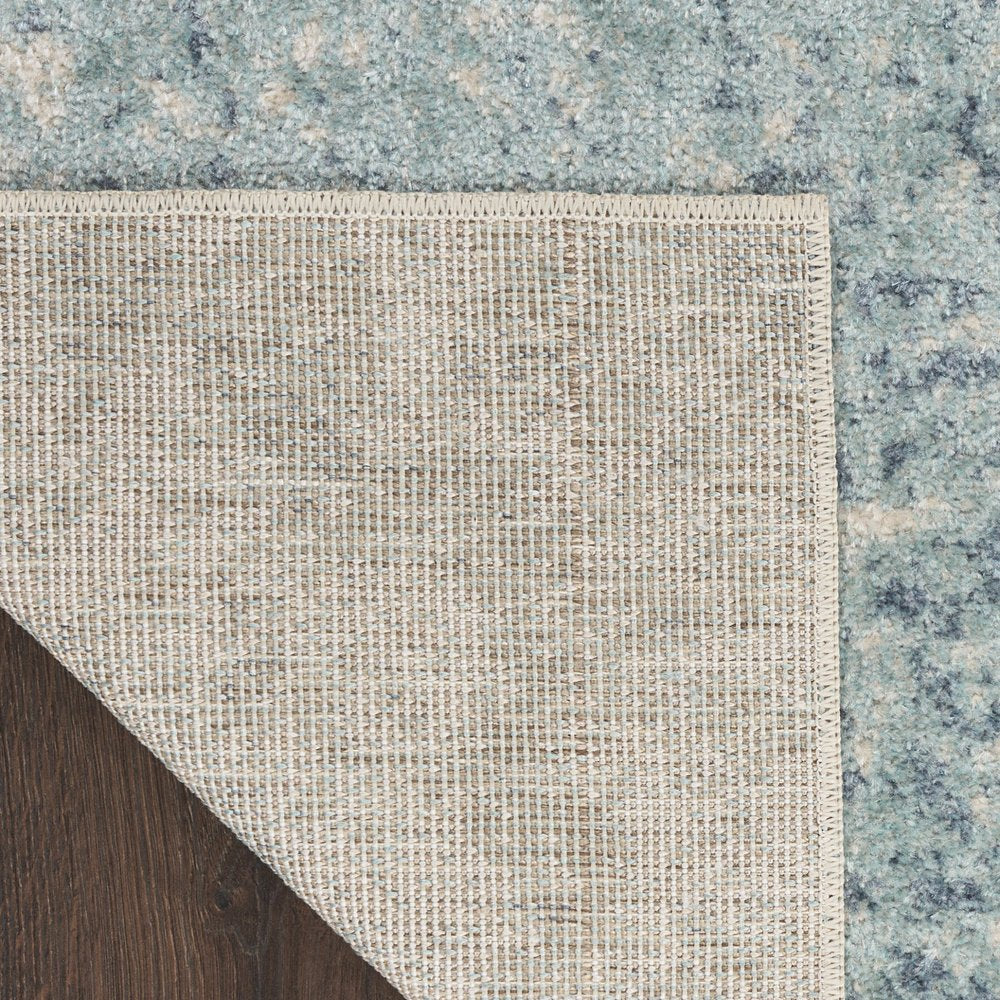 4' X 6' Blue and Ivory Abstract Power Loom Washable Area Rug