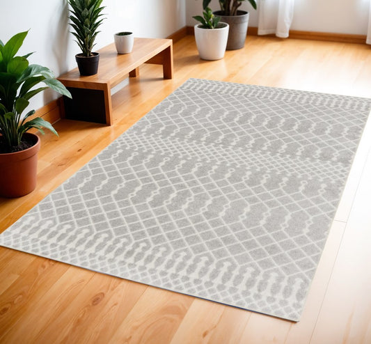 4' X 6' Blue and Ivory Abstract Power Loom Washable Area Rug
