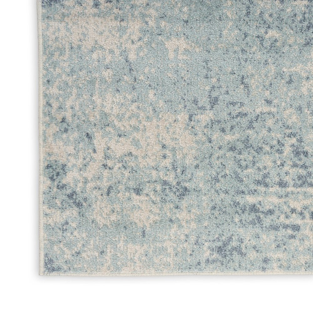 4' X 6' Blue and Ivory Abstract Power Loom Washable Area Rug