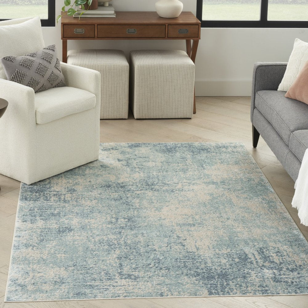 4' X 6' Blue and Ivory Abstract Power Loom Washable Area Rug