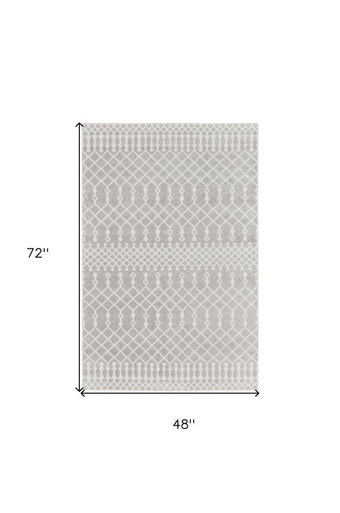 4' X 6' Blue and Ivory Abstract Power Loom Washable Area Rug