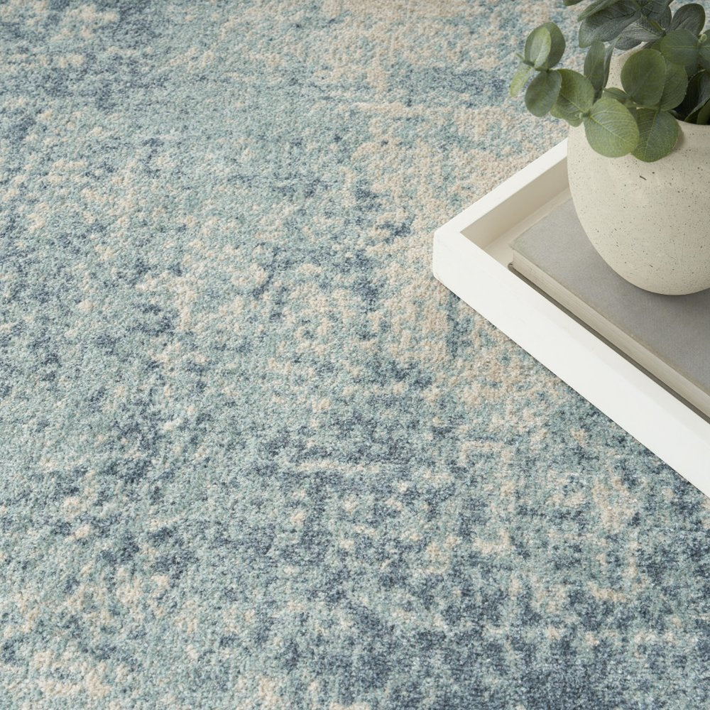 4' X 6' Blue and Ivory Abstract Power Loom Washable Area Rug