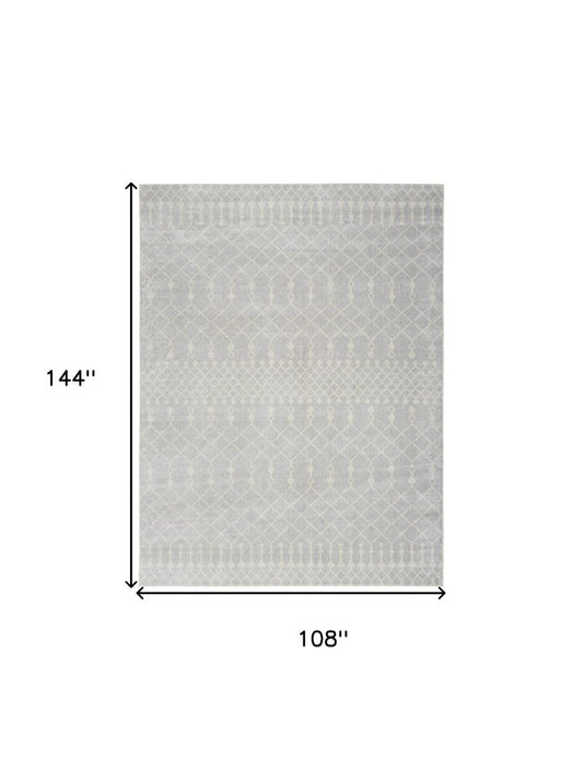 9' X 12' Blue and Ivory Abstract Power Loom Washable Area Rug