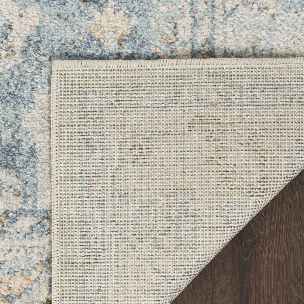 7' X 9' Blue and Ivory Floral Medallion Power Loom Distressed Washable Area Rug