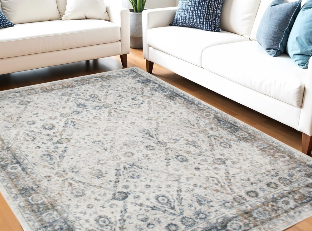 7' X 9' Blue and Ivory Floral Medallion Power Loom Distressed Washable Area Rug