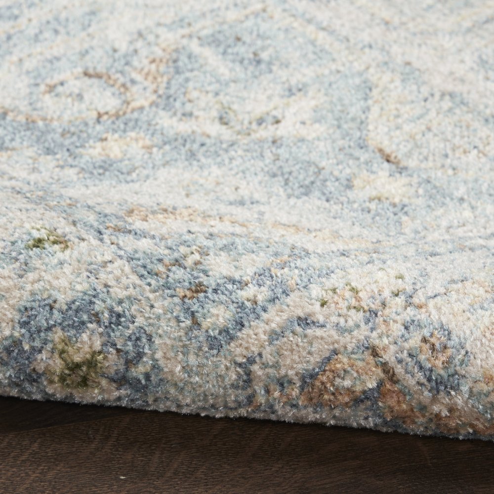 7' X 9' Blue and Ivory Floral Medallion Power Loom Distressed Washable Area Rug