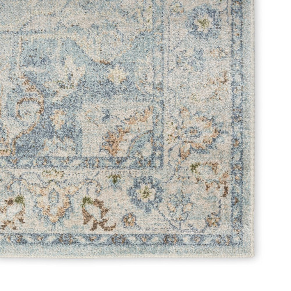 7' X 9' Blue and Ivory Floral Medallion Power Loom Distressed Washable Area Rug