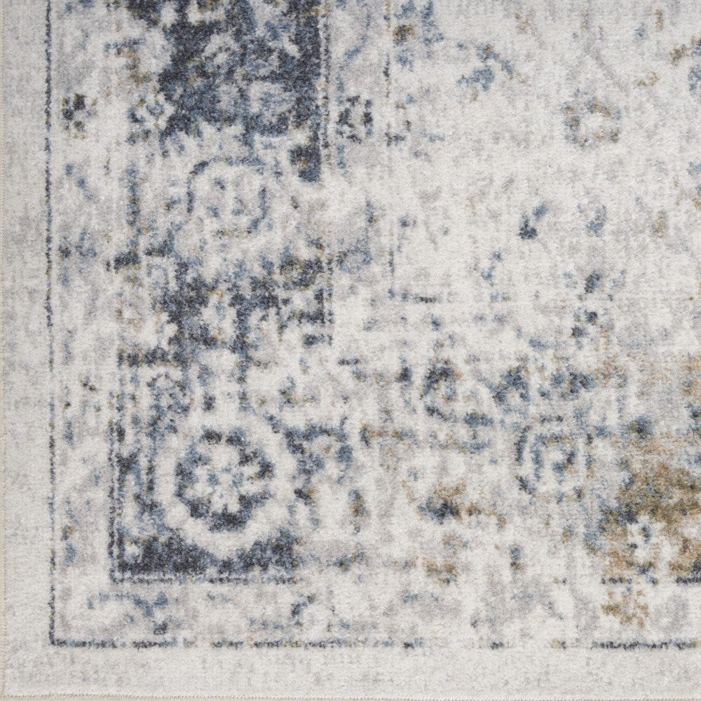 8' X 10' Blue and Ivory Floral Medallion Power Loom Distressed Washable Area Rug