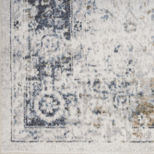 8' X 10' Blue and Ivory Floral Medallion Power Loom Distressed Washable Area Rug