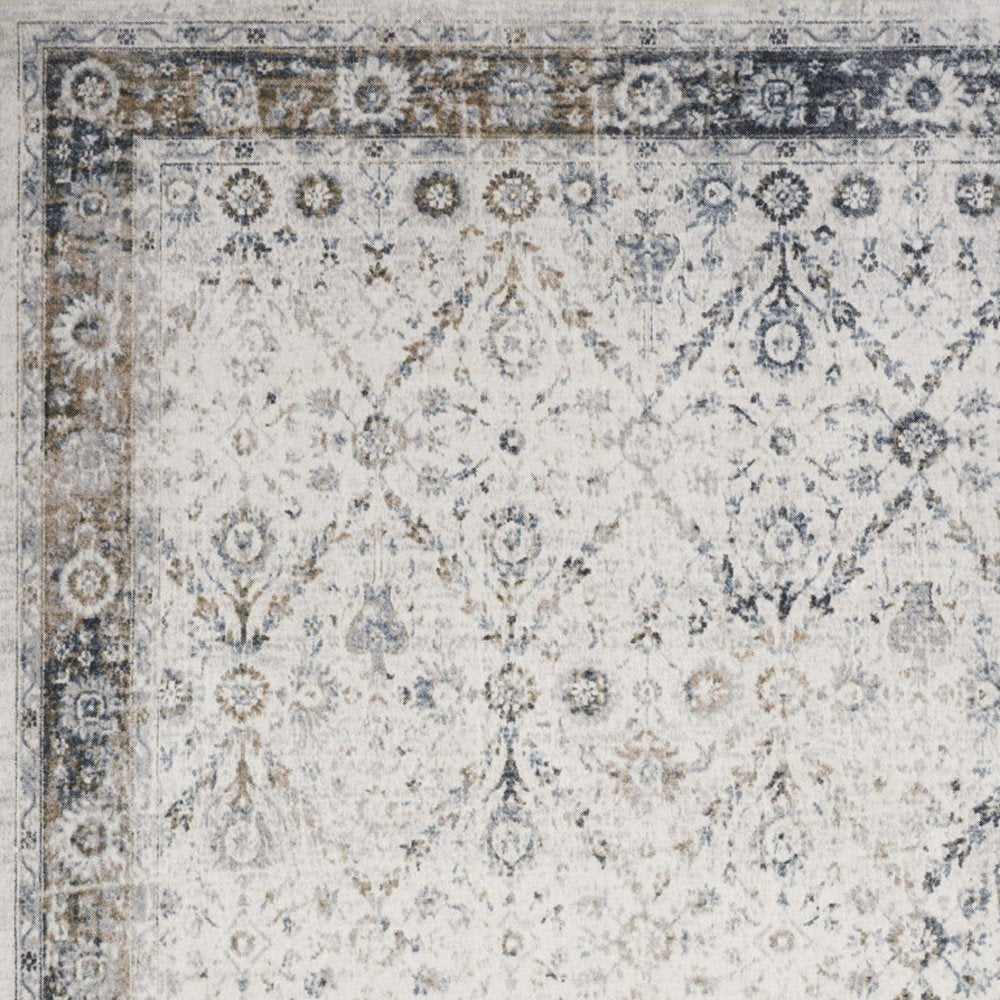 8' X 10' Blue and Ivory Floral Medallion Power Loom Distressed Washable Area Rug