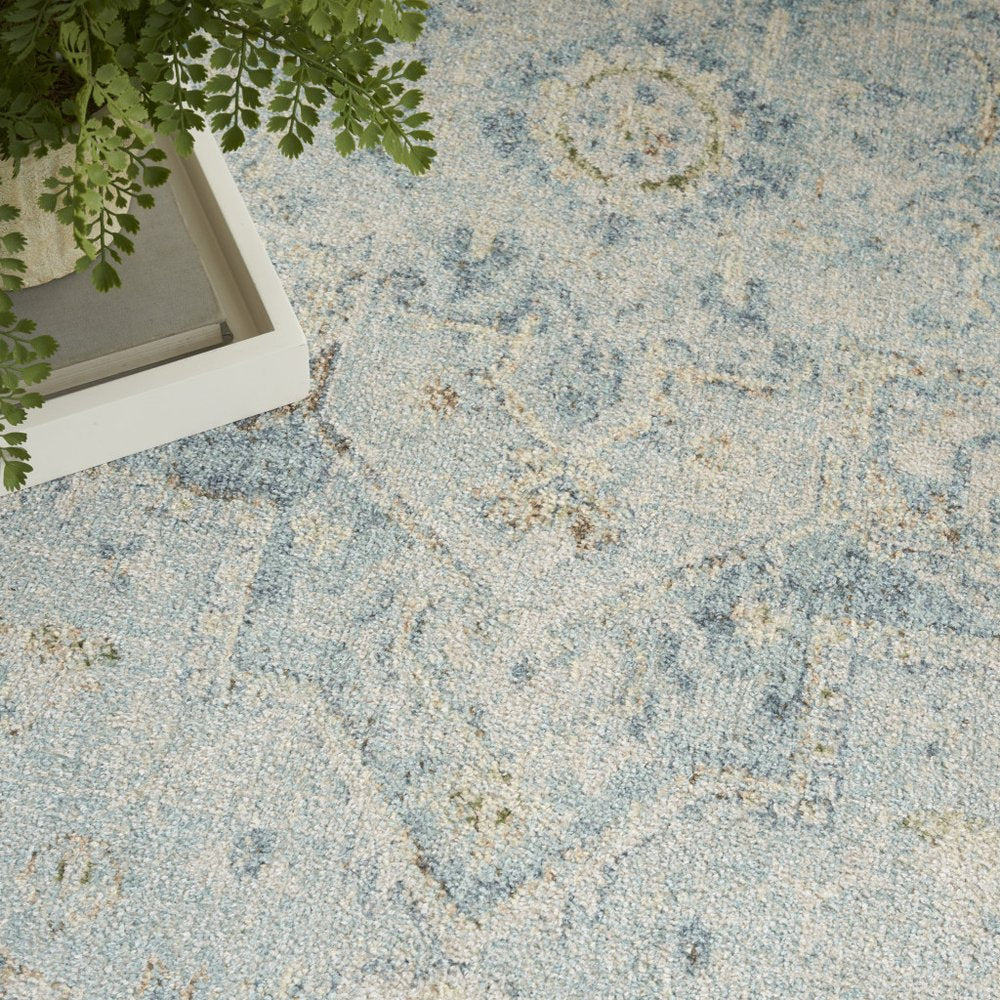 8' X 10' Blue and Ivory Floral Medallion Power Loom Distressed Washable Area Rug