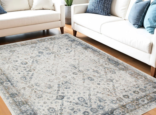 9' X 12' Blue and Ivory Floral Medallion Power Loom Distressed Washable Area Rug