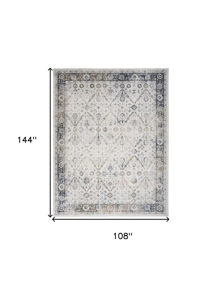 9' X 12' Blue and Ivory Floral Medallion Power Loom Distressed Washable Area Rug