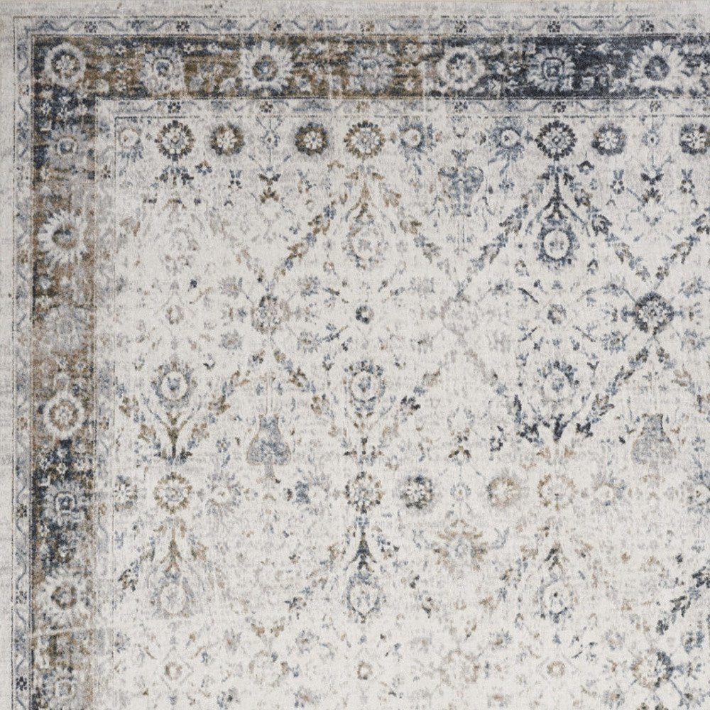 9' X 12' Blue and Ivory Floral Medallion Power Loom Distressed Washable Area Rug