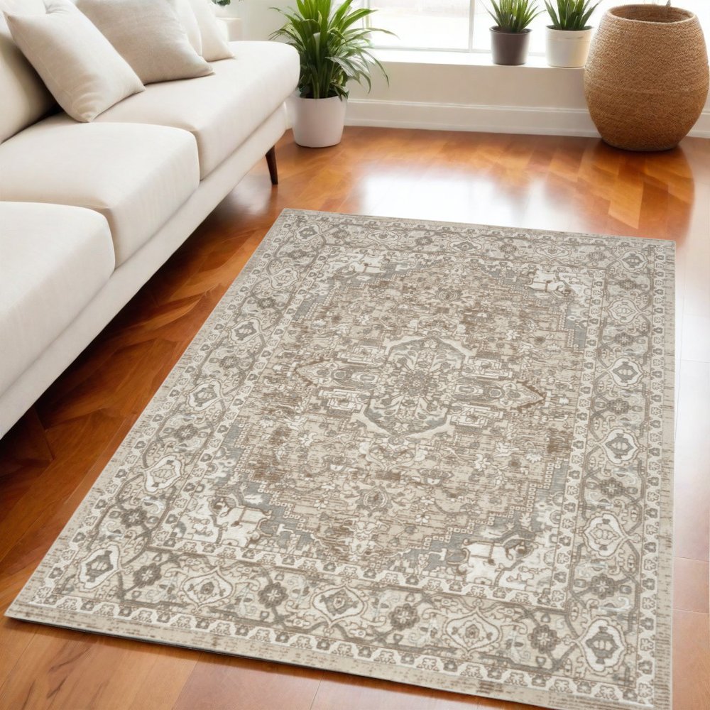 5' X 7' Beige and Ivory Medallion Power Loom Distressed Area Rug