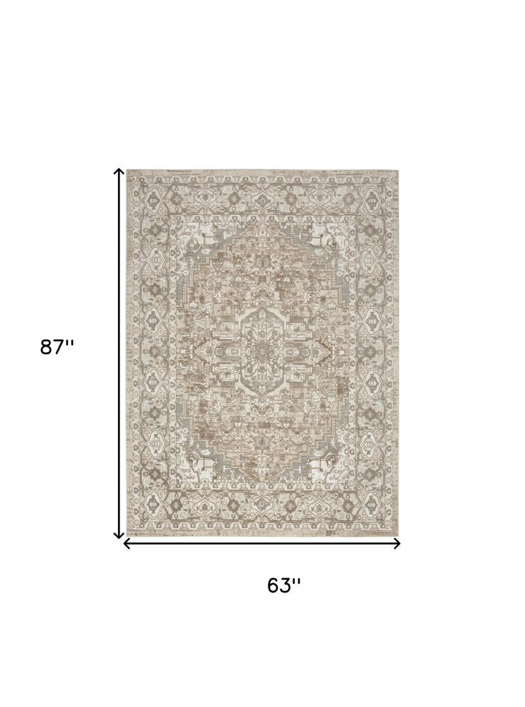 5' X 7' Beige and Ivory Medallion Power Loom Distressed Area Rug