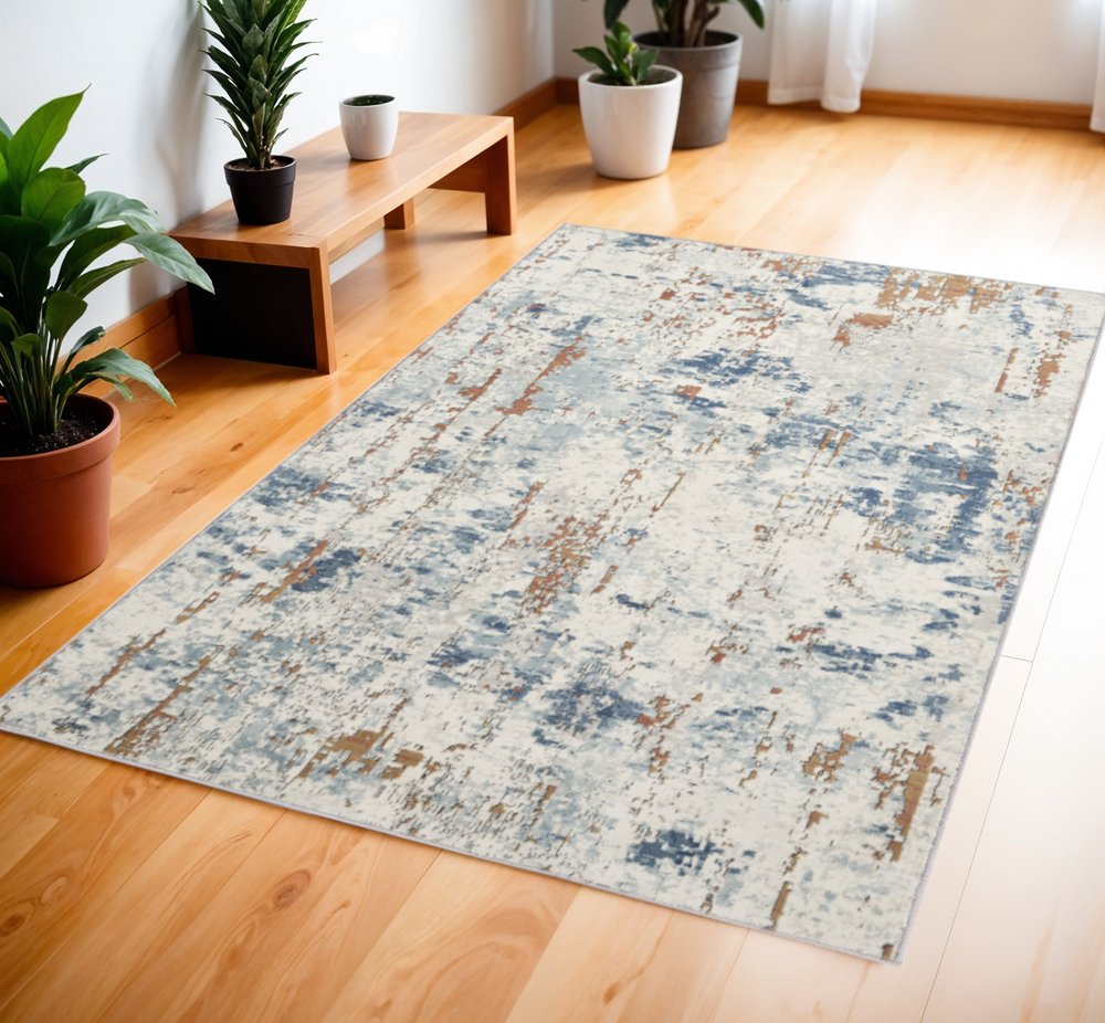 4' X 6' Beige and Blue Abstract Power Loom Area Rug
