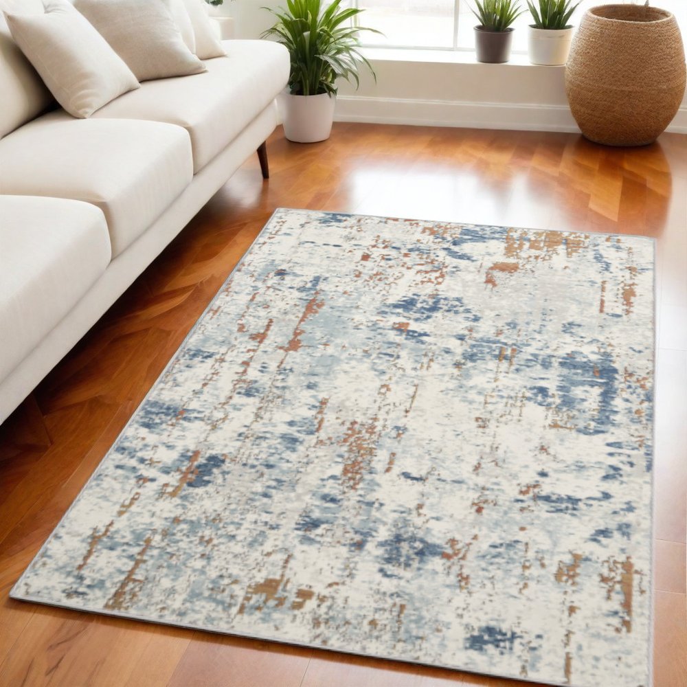 5' X 7' Beige and Blue Abstract Power Loom Area Rug