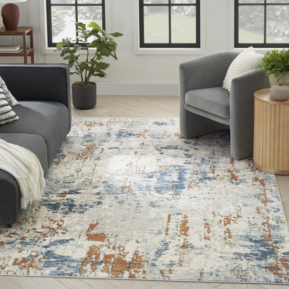 5' X 7' Beige and Blue Abstract Power Loom Area Rug