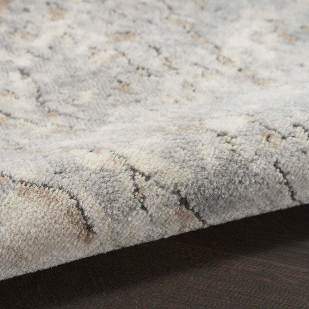 8' Beige and Gray Round Abstract Power Loom Area Rug