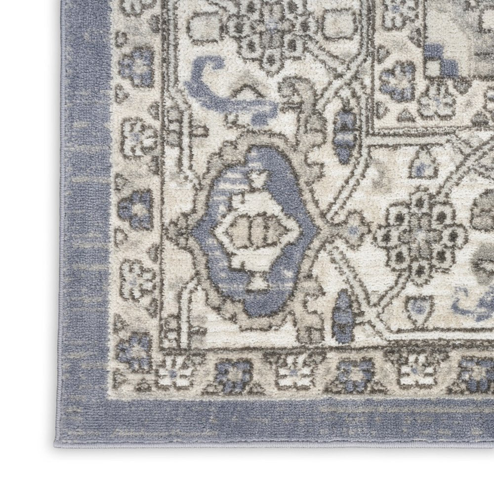 5' X 7' Blue and Ivory Medallion Power Loom Distressed Area Rug
