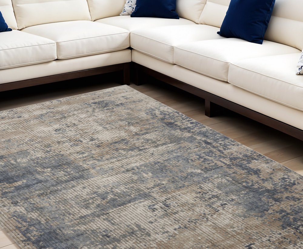 7' X 10' Beige and Blue Abstract Power Loom Distressed Area Rug