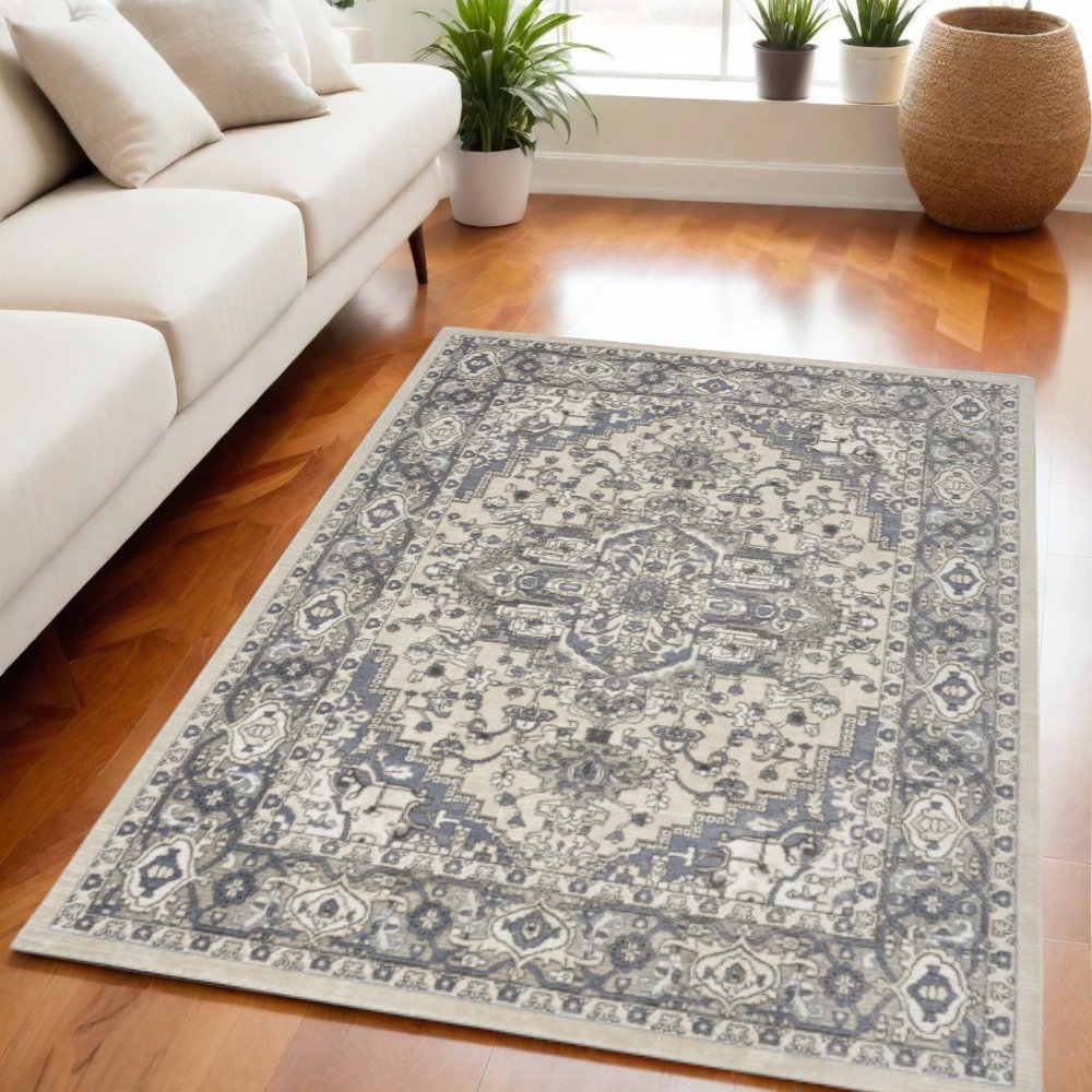 5' X 7' Blue and Ivory Medallion Power Loom Distressed Area Rug