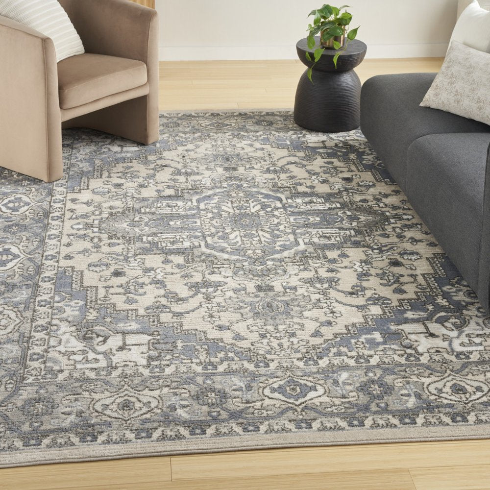 5' X 7' Blue and Ivory Medallion Power Loom Distressed Area Rug
