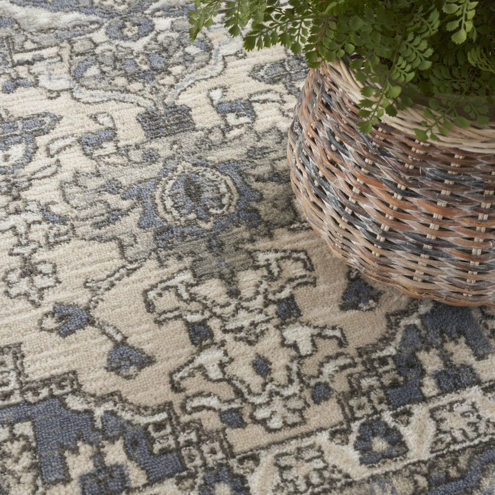 5' X 7' Blue and Ivory Medallion Power Loom Distressed Area Rug