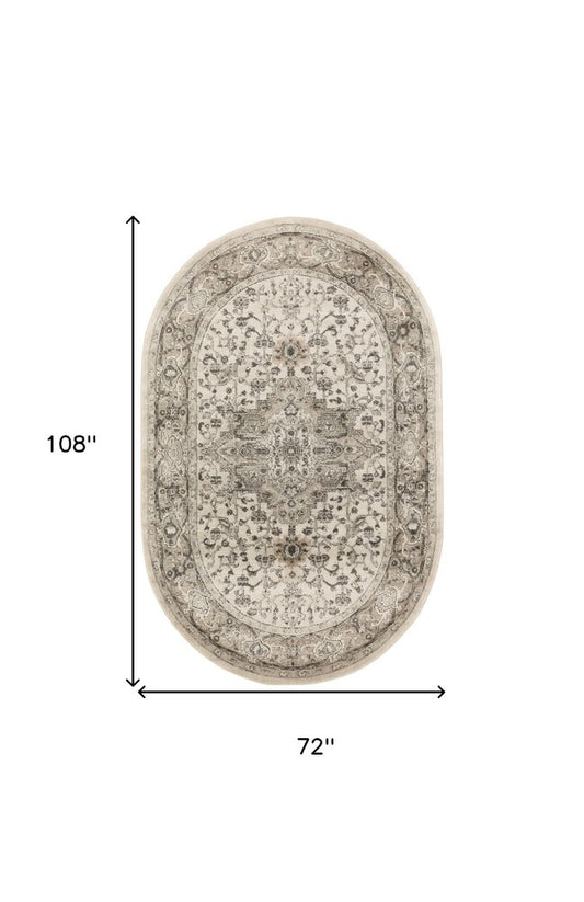 6' X 9' Gray and Ivory Medallion Power Loom Distressed Area Rug