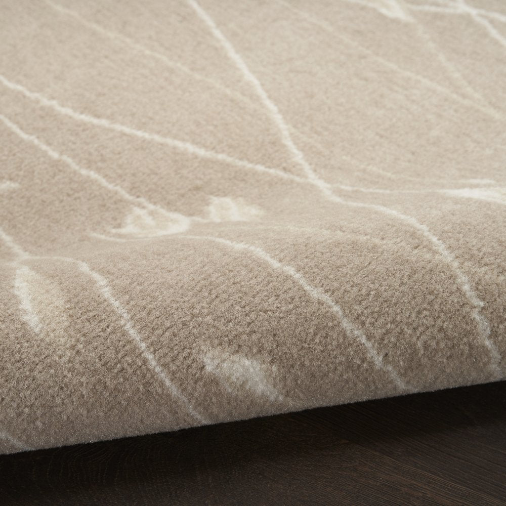 5' X 7' Beige and Ivory Floral Power Loom Area Rug