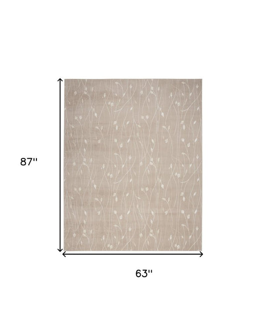 5' X 7' Beige and Ivory Floral Power Loom Area Rug