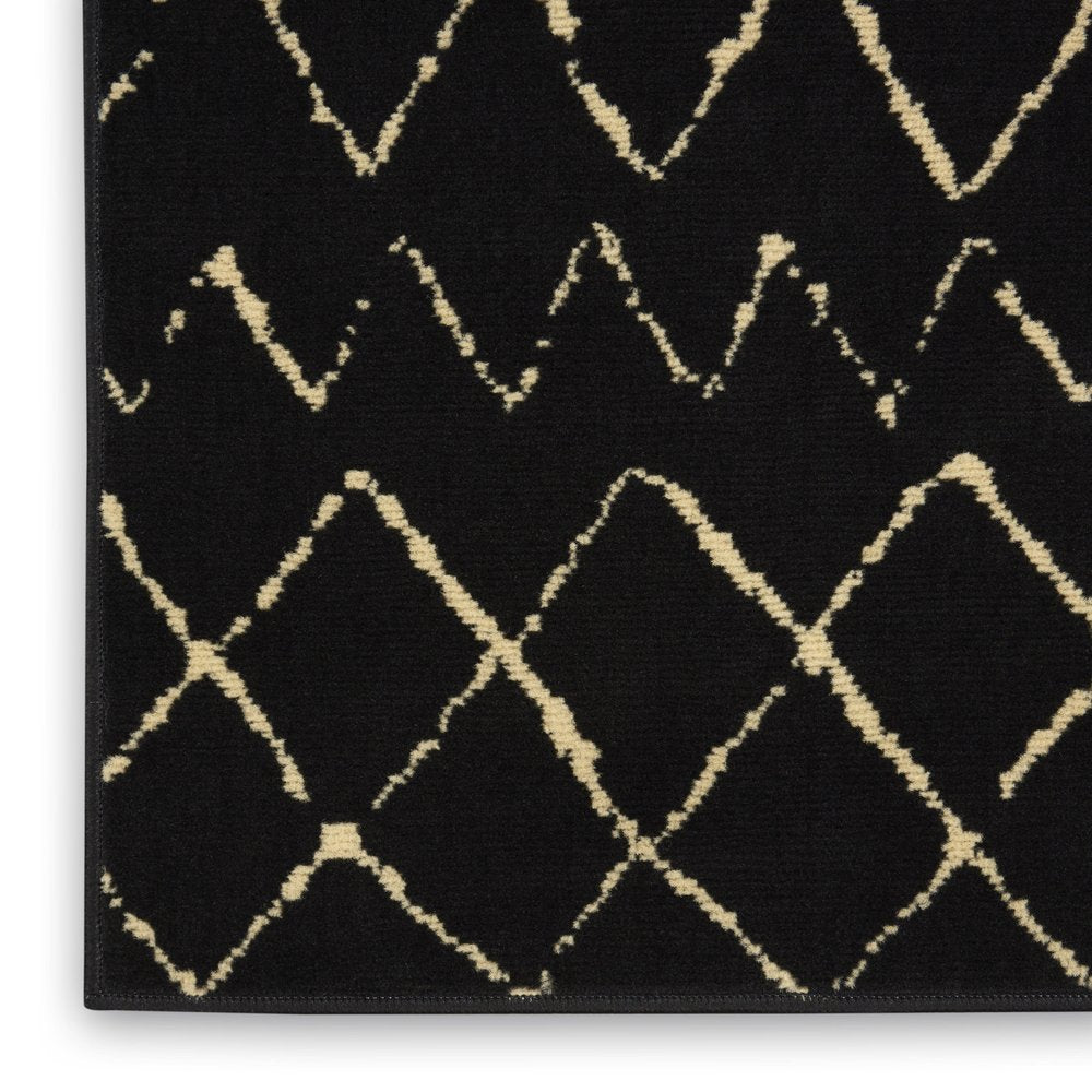 6' X 9' Black and Ivory Abstract Power Loom Distressed Area Rug