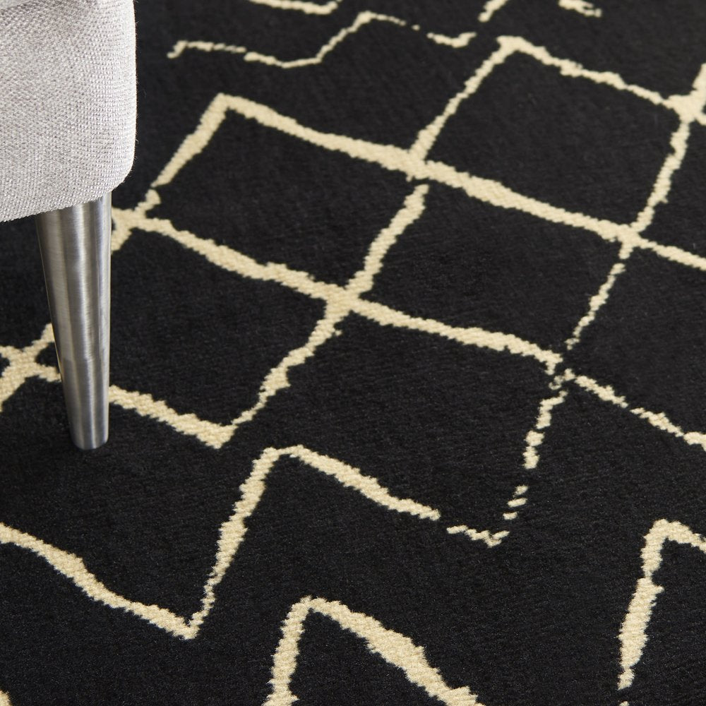 6' X 9' Black and Ivory Abstract Power Loom Distressed Area Rug