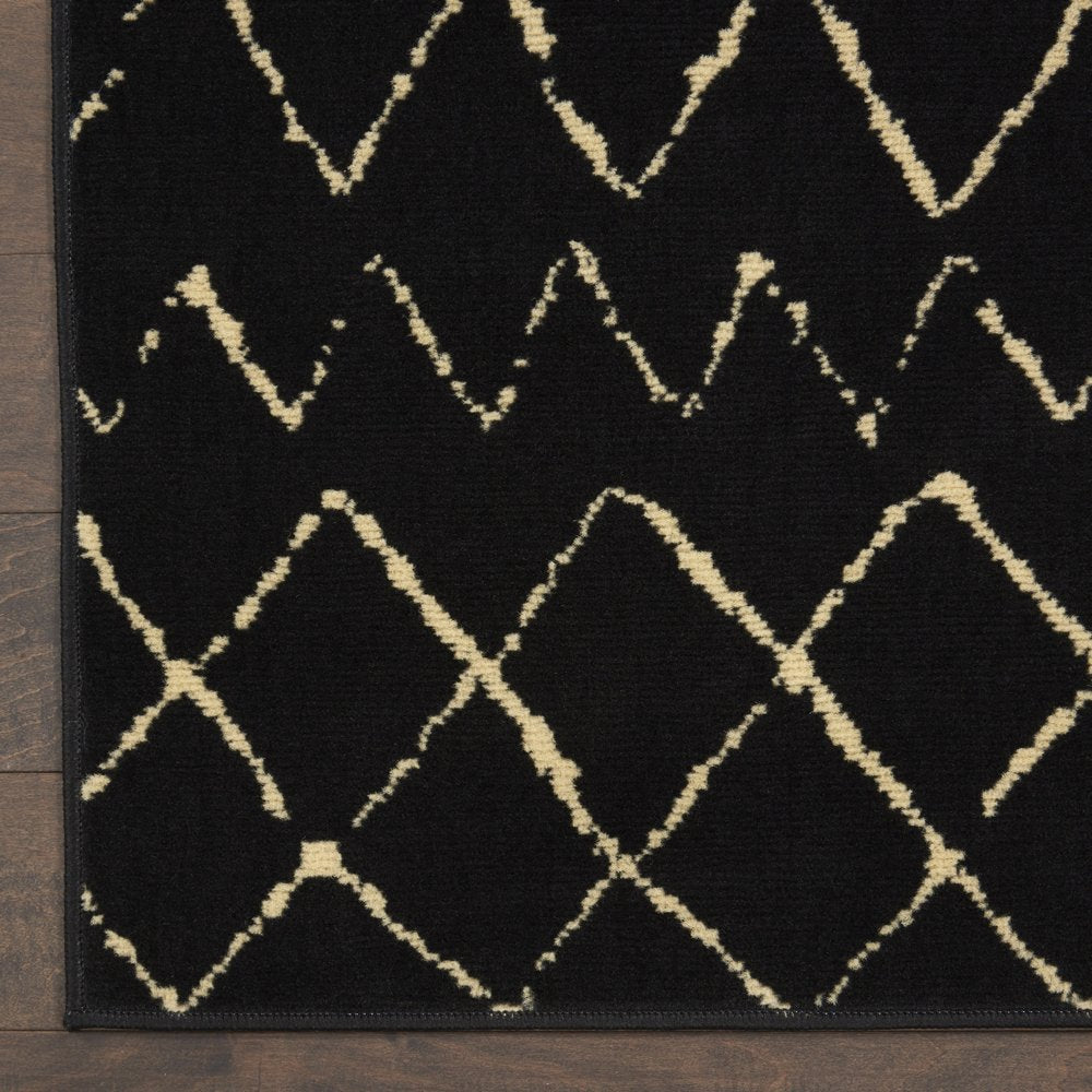 6' X 9' Black and Ivory Abstract Power Loom Distressed Area Rug
