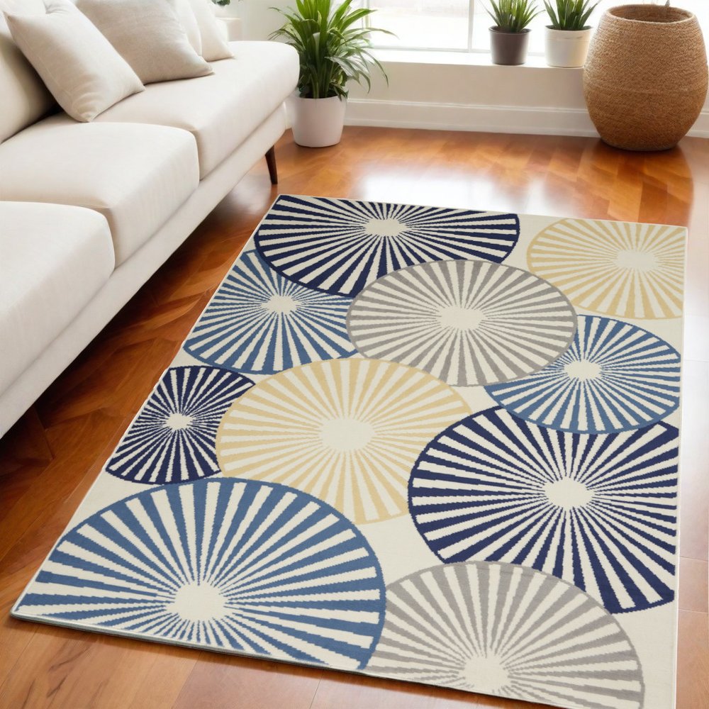 5' X 7' Blue and Ivory Geometric Power Loom Area Rug