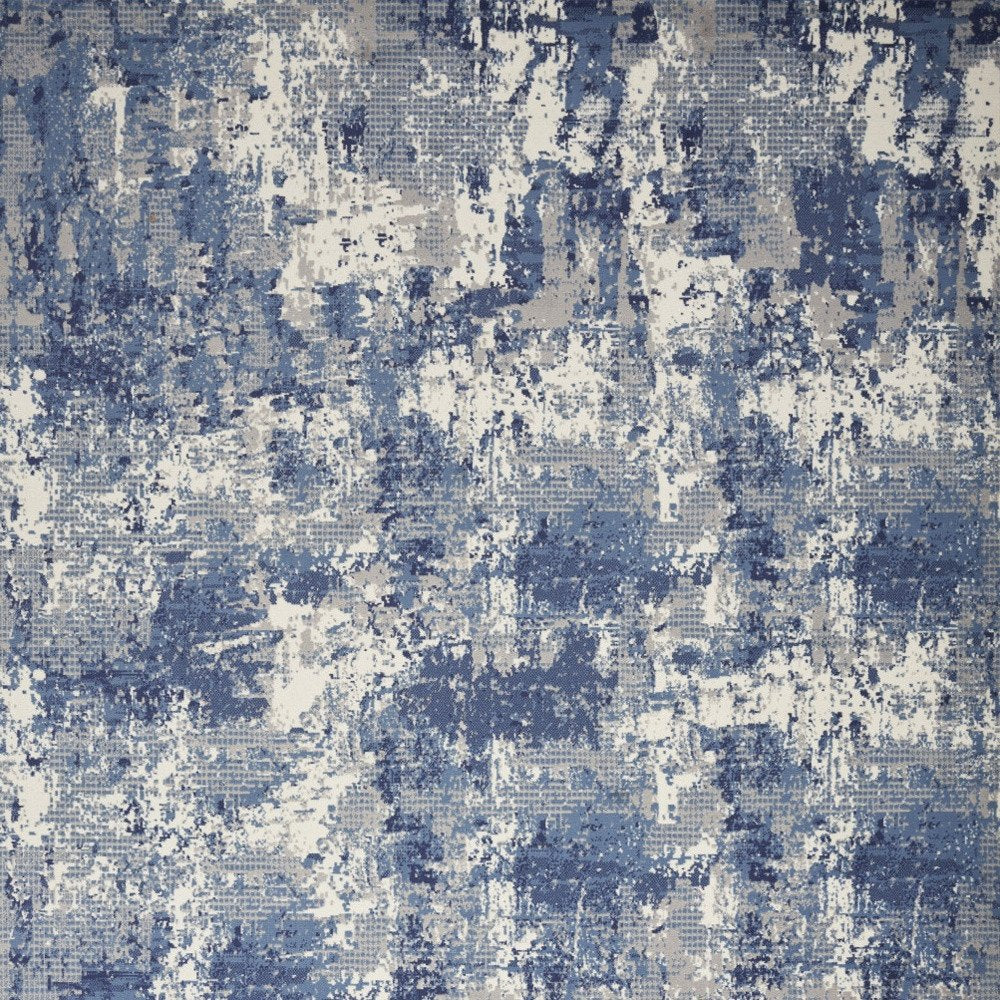 5' X 7' Blue and Ivory Abstract Power Loom Area Rug