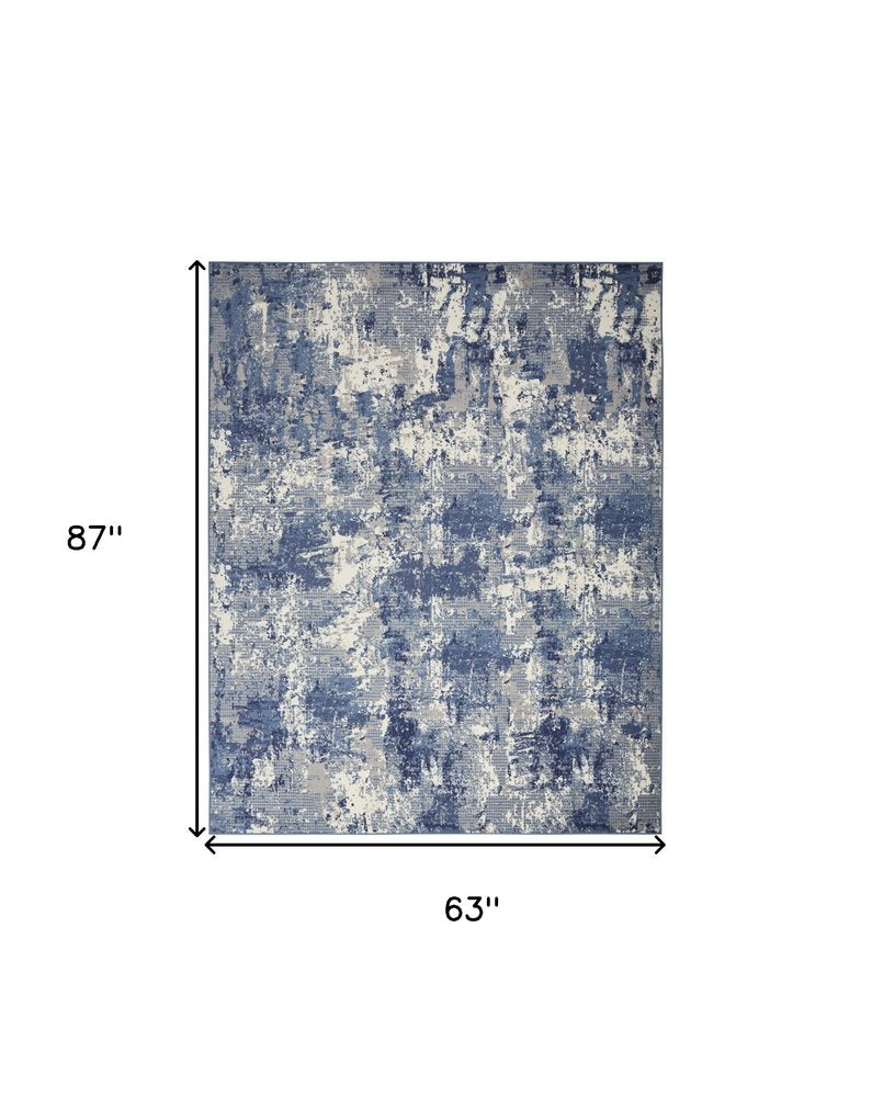 5' X 7' Blue and Ivory Abstract Power Loom Area Rug
